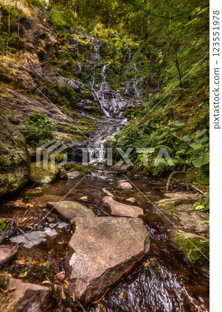Pilj Waterfall Cascading through Green Mountain Forest Pilj Waterfall Cascading through Green Mountain Forest 123551978