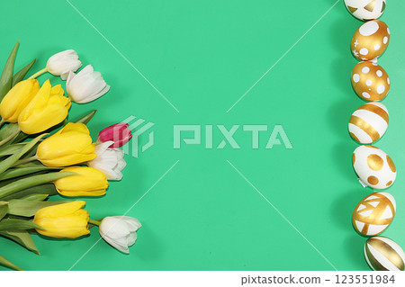 Decorated golden and blue eggs on a trendy green background. Minimal holiday concept. Happy Easter background, place for text, postcard, banner for the screen. 123551984