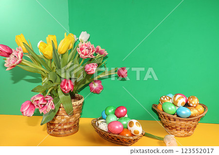 Decorated golden easter eggs on trendy green background. Minimal holiday concept. Happy Easter background, place for text, postcard, banner for the screen. 123552017