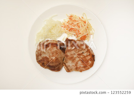 Roast pork loin with salad. Delicious meat breakfast. 123552259