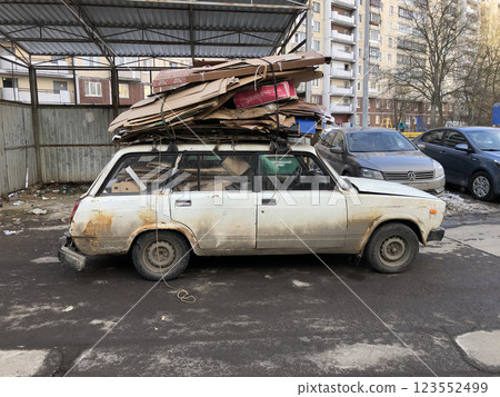 Loading waste paper into an old pickup 123552499