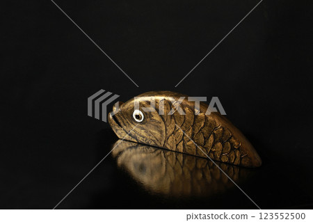 Goldfish, golden reflection, black background 123552500