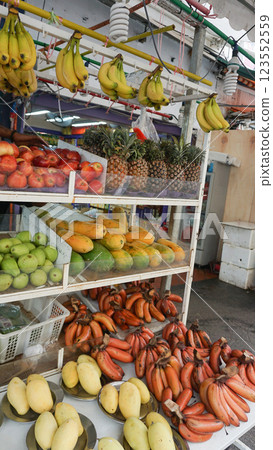A very colorful market stall full of fruits at the wet market in Chinatown at Singapore. 123552559