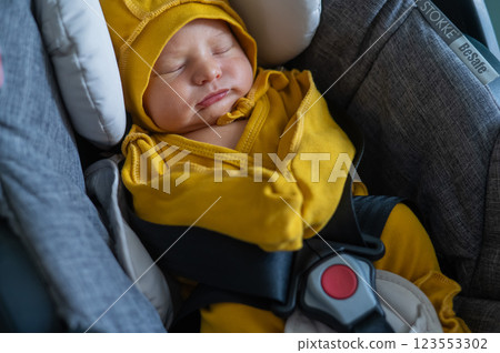 Newborn baby sleeping in car seat. Newborn baby sleeping in car seat. 123553302