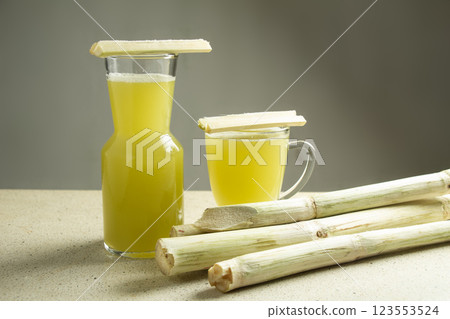 two glasses of sugar cane juice drink on white marble table isolated two glasses of sugar cane juice drink on white marble table isolated 123553524