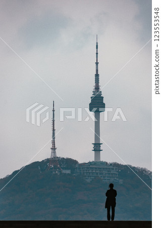 A woman looking at the Namsan Seoul Tower 123553548