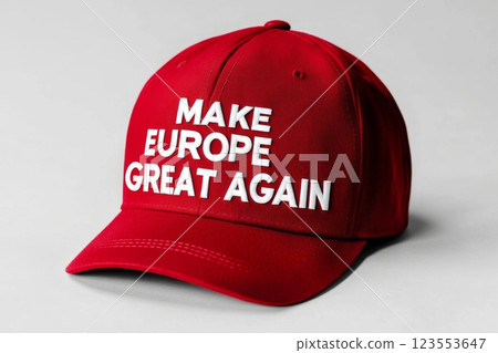 Red cap with slogan Make Europe Great Again emblazoned in white letters representing a political statement often associated with populist movements across Europe in a casual setting 123553647