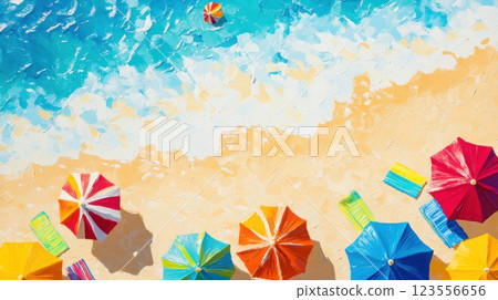 Overhead view of colorful beach umbrellas and lounge chairs on sandy beach next to ocean waves. 123556656
