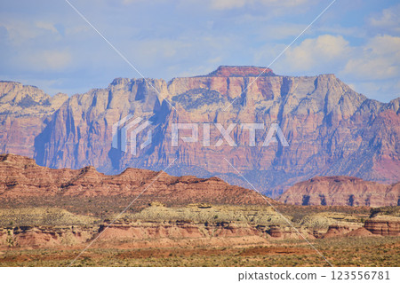 Red Rock Cliffs and Desert Landscape at Golden Hour Eye-Level View Red Rock Cliffs and Desert Landscape at Golden Hour Eye-Level View 123556781