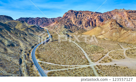 Aerial of Desert Road and Rocky Hills in Nevada Aerial of Desert Road and Rocky Hills in Nevada 123557127