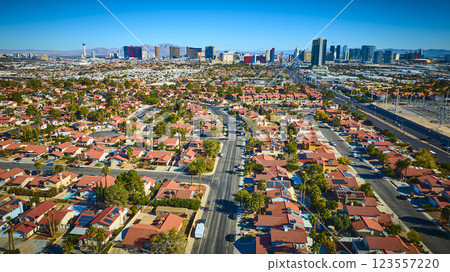 Aerial Las Vegas Suburb and Strip Skyline with Mountains in Background Aerial Las Vegas Suburb and Strip Skyline with Mountains in Background 123557220