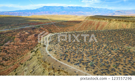Aerial of Gooseberry Mesa Desert Landscape with Road and Mountains Aerial of Gooseberry Mesa Desert Landscape with Road and Mountains 123557296