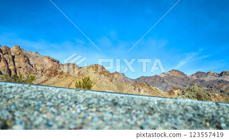 Aerial of Rugged Desert Mountains in Nevada Under Blue Sky Aerial of Rugged Desert Mountains in Nevada Under Blue Sky 123557419