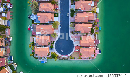 Aerial Top Down of Symmetrical Waterfront Suburb with Emerald Waters Aerial Top Down of Symmetrical Waterfront Suburb with Emerald Waters 123557441