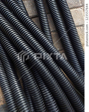 Unique Design of Corrugated Boiler Protection Pipes on a Construction Site in a Vibrant Setting 123557644