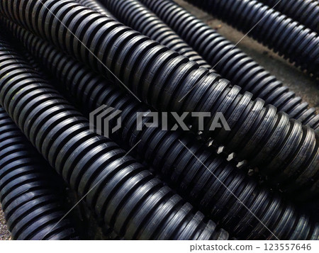 Detailed View of Corrugated Boiler Protection Pipes Arranged for Installation in Industrial Setting 123557646