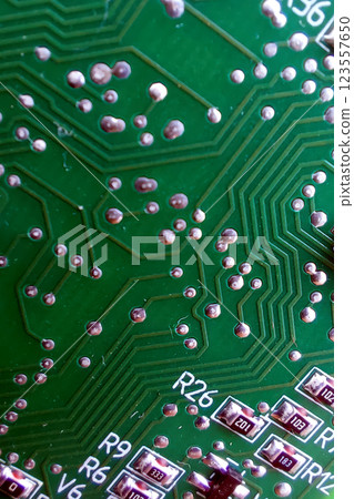 Close-up View of Intricate Circuitry on an Electronic Board Showcasing Detailed Connections Close-up View of Intricate Circuitry on an Electronic Board Showcasing Detailed Connections 123557650