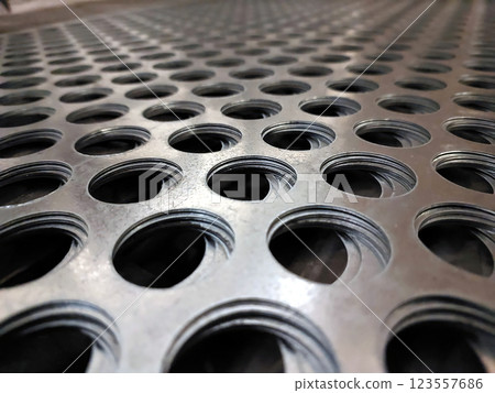 Intricate Patterns of Stainless Steel Mesh Showcase Industrial Design During Daylight Hours Intricate Patterns of Stainless Steel Mesh Showcase Industrial Design During Daylight Hours 123557686