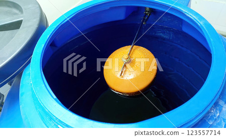 Essential Function of a Water Valve Float Controlling Water Levels in a Tank 123557714