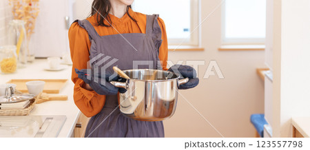 A woman who cooks in the kitchen 123557798