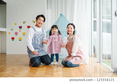 Nursery teachers and children working at a nursery school Nursery teachers and children working at a nursery school 123558115
