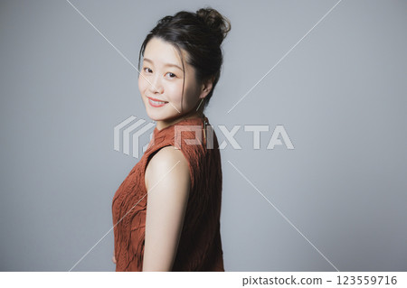 Woman in brown dress Woman in brown dress 123559716