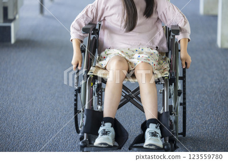 Elementary school student in a wheelchair 123559780