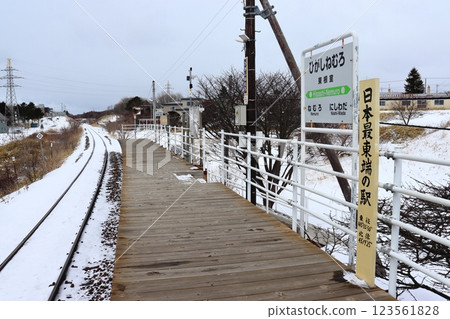 Snow-covered station sign and guide board at Higashi Nemuro Station, formerly the easternmost station in Japan 123561828