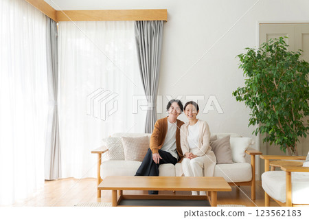 A relaxing couple in the living room A relaxing couple in the living room 123562183