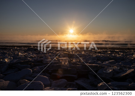 Jewelry ice washing onto the shore Jewelry ice washing onto the shore 123562300