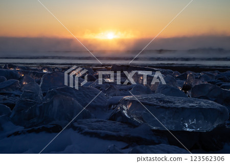 Jewelry ice washing onto the shore Jewelry ice washing onto the shore 123562306