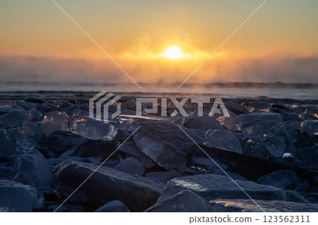 Jewelry ice washing onto the shore 123562311