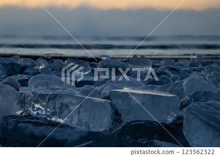 Jewelry ice washing onto the shore Jewelry ice washing onto the shore 123562322