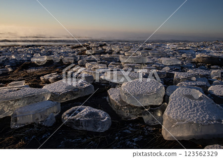 Jewelry ice washing onto the shore Jewelry ice washing onto the shore 123562329