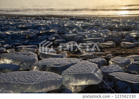 Jewelry ice washing onto the shore Jewelry ice washing onto the shore 123562330