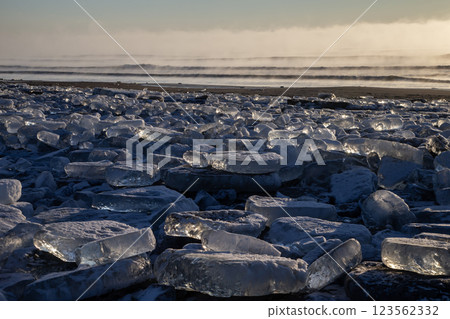 Jewelry ice washing onto the shore Jewelry ice washing onto the shore 123562332