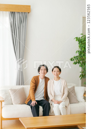 A relaxing couple in the living room A relaxing couple in the living room 123562565