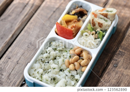 Homemade Japanese bento box using a bento box with integrated dividers Homemade Japanese bento box using a bento box with integrated dividers 123562890