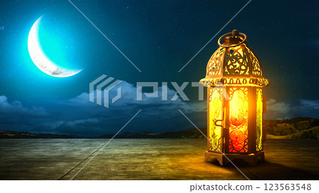 Traditional glowing Arabic lantern with crescent moon view on night scene background. Copy space or mockup. Concept of Eid Al Fitr and Ramadan Mubarak. Islamic background 123563548