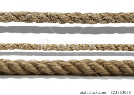 Closeup view set of various straight ropes string isolated over white background 123563656
