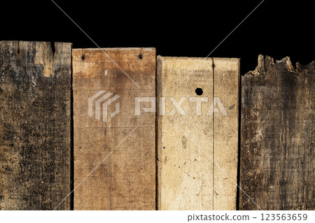 Closeup view arranged wooden fence with a black background. Natural wooden texture or brown background or wallpaper. Copy space or mockup Closeup view arranged wooden fence with a black background. Natural wooden texture or brown background or wallpaper. Copy space or mockup 123563659