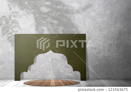 Green paper arch like mosque dome on wooden table with gray wall background. Islamic pattern. Copy space. Concept of Religion, Spiritual or Ramadan 123563675