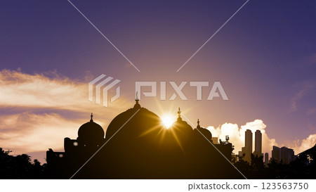 View of the silhouette of the mosque with sunlight in the sunset scene background. Concept of Religion, Spiritual or Ramadan View of the silhouette of the mosque with sunlight in the sunset scene background. Concept of Religion, Spiritual or Ramadan 123563750