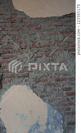 Aged brown brick wall with rough texture and weathered surface structure Aged brown brick wall with rough texture and weathered surface structure 123565179