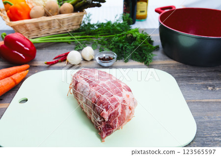 Pork shoulder loin wrapped in net Pork shoulder loin wrapped in net 123565597