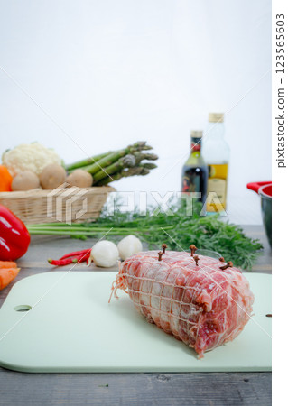 Pork shoulder loin wrapped in net 123565603