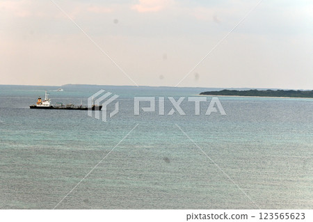 Taketomi Island, cargo ship offshore 123565623