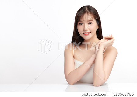 Beautiful young asian woman with clean fresh skin on white background, Face care, Facial treatment, Cosmetology, beauty and spa, Asian women portrait. Beautiful young asian woman with clean fresh skin on white background, Face care, Facial treatment, Cosmetology, beauty and spa, Asian women portrait. 123565790