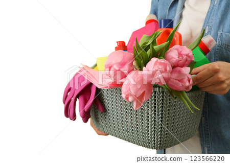Spring cleaning, cleaning supplies and a bouquet of tulips in a plastic basket in hands isolated on a white background, with space for text, PNG Spring cleaning, cleaning supplies and a bouquet of tulips in a plastic basket in hands isolated on a white background, with space for text, PNG 123566220