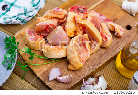 Raw chicken with condiments on kitchen table Raw chicken with condiments on kitchen table 123566229